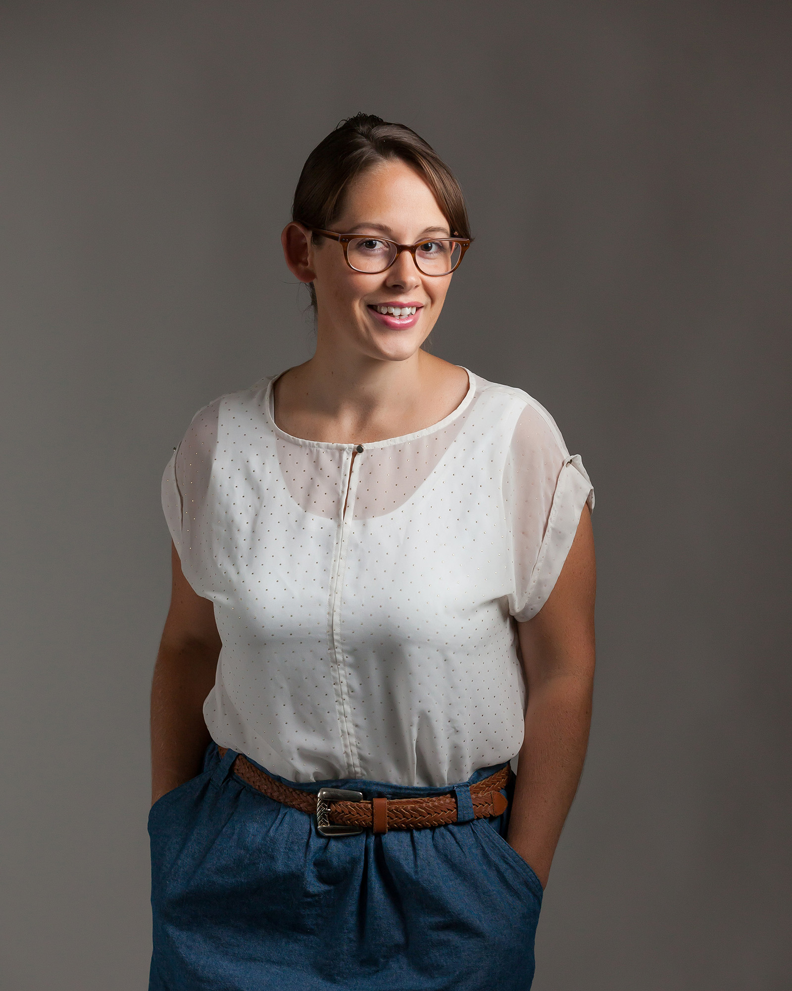 Professional headshot of a woman with a warm smile