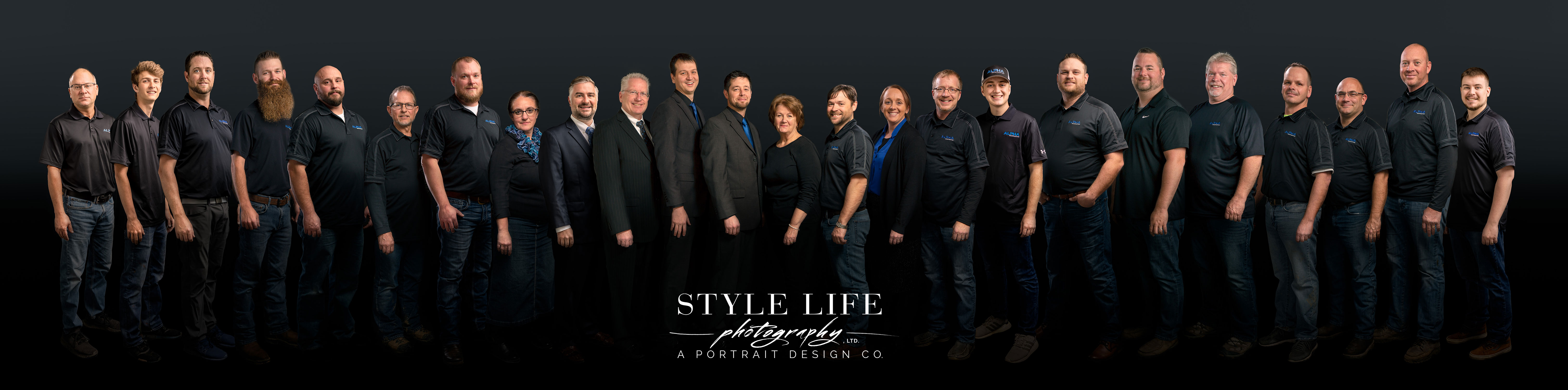 Team group composite photo of more than twenty people, created from individual headshots photographed on site